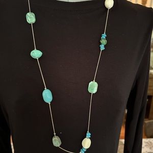 18” decorative stone necklace. Silver chain.  Excellent condition.